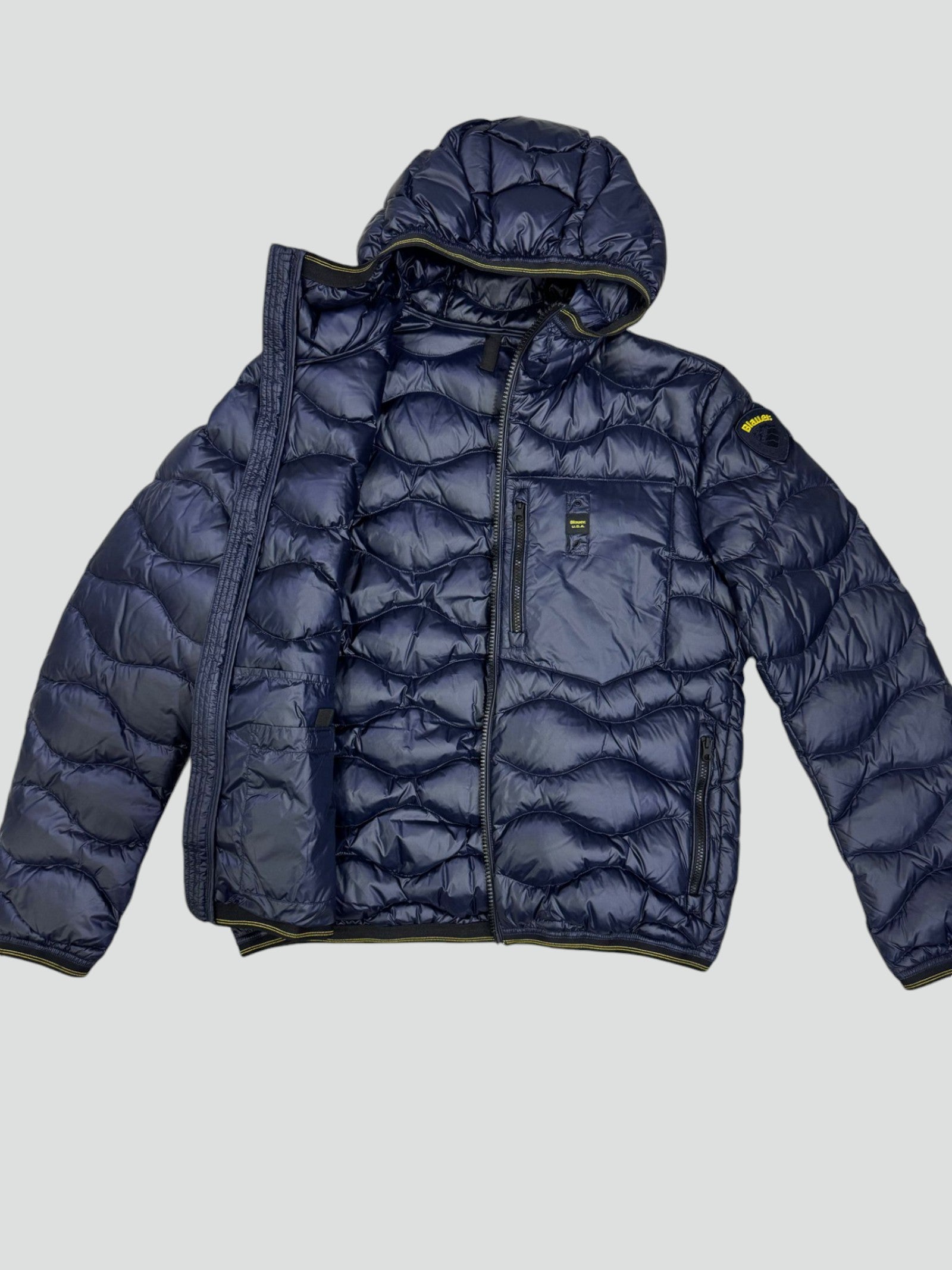 Piumino blu "Wave" con Trapuntatura a Onde e Cappuccio