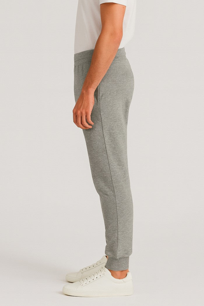 Pantaloni tuta grigio melange con patch gommata e fondo elasticizzato 