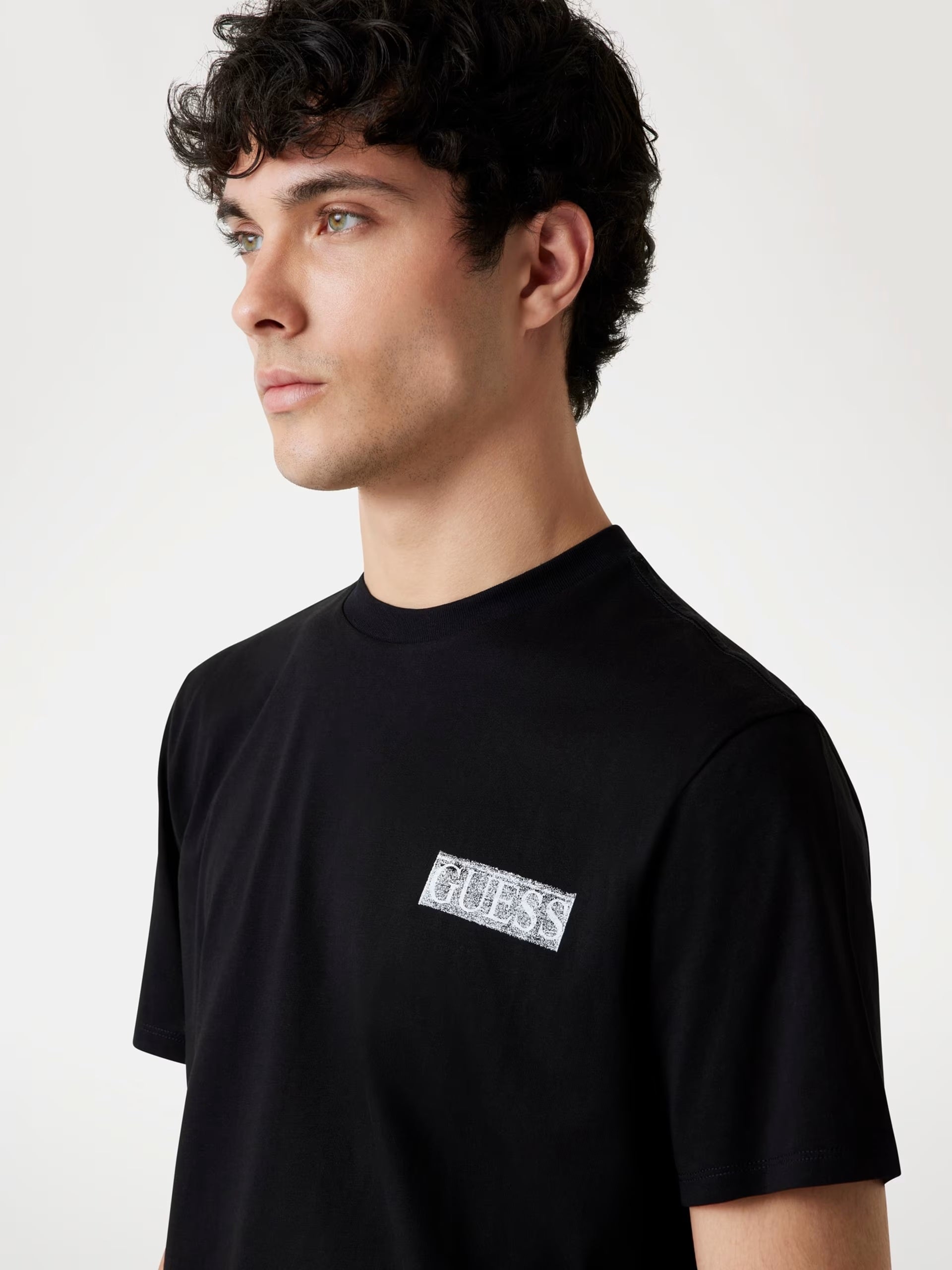 T-shirt nera con Logo Oversize bianco sul Retro e Vestibilità Regular 