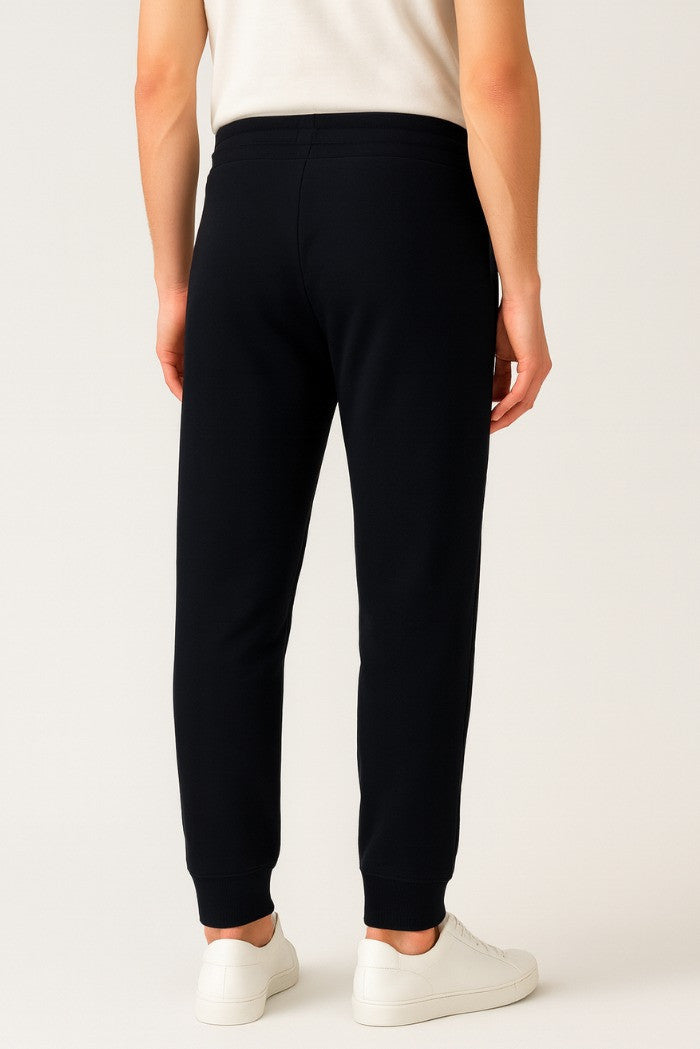 Pantaloni tuta da uomo blu con patch gommata e fondo elasticizzato 
