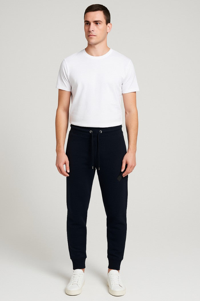 Pantaloni tuta da uomo blu con patch gommata e fondo elasticizzato 